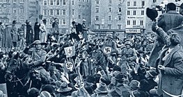 1938 онд Австрид Германы цэргүүдийг угтан авч байгаа нь