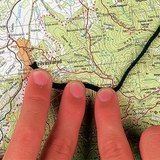 Using a string to determine the distance of a curved line on the map